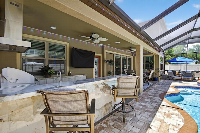 10313 Scarlet Chase Dr, Riverview, FL 33569 - view of patio / terrace with an outdoor kitchen, glass enclosure, and a ceiling fan
