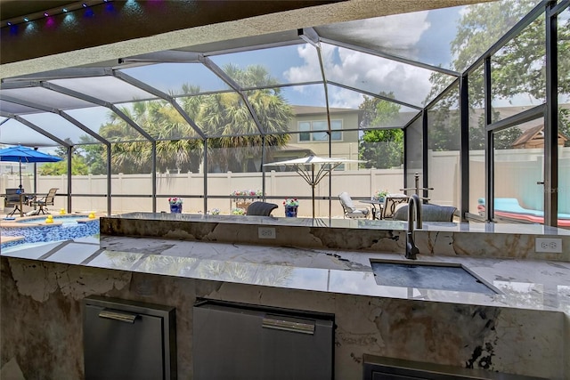10313 Scarlet Chase Dr, Riverview, FL 33569 - fenced backyard with glass enclosure, area for grilling, a patio, and a bar