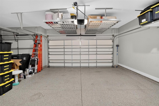 10313 Scarlet Chase Dr, Riverview, FL 33569 - garage featuring baseboards and a garage door opener