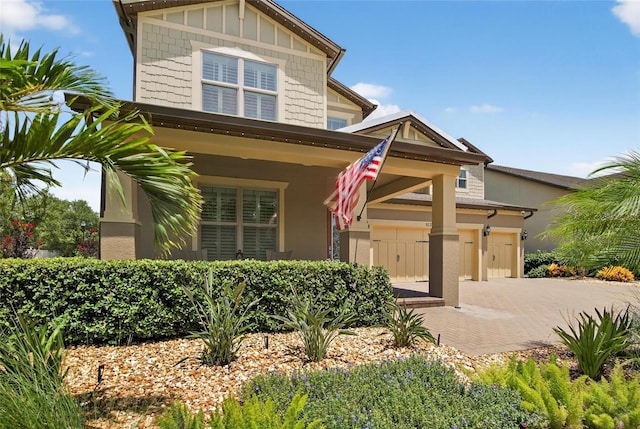 10313 Scarlet Chase Dr, Riverview, FL 33569 - craftsman-style house featuring decorative driveway and an attached garage