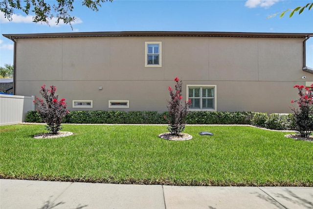 10313 Scarlet Chase Dr, Riverview, FL 33569 - view of side of home featuring a yard and stucco siding