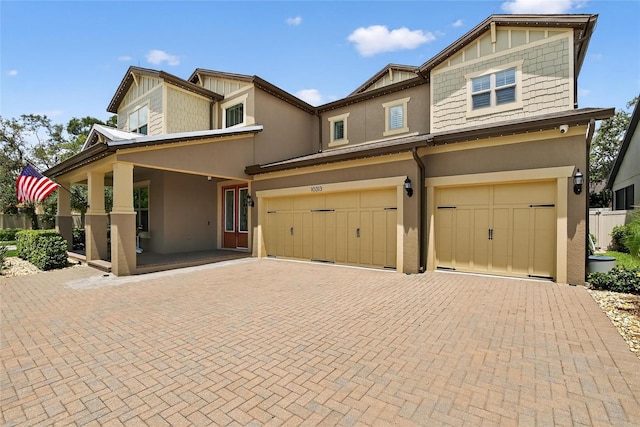 10313 Scarlet Chase Dr, Riverview, FL 33569 - view of front of home featuring stucco siding, an attached garage, and decorative driveway