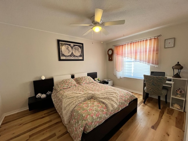 8616 Pinafore Dr, New Port Richey, FL 34653 - bedroom featuring light wood finished floors and ceiling fan