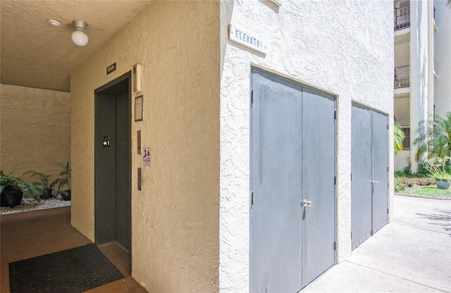 700 Starkey Rd Unit 1145, Largo, FL 33771 - entrance to property featuring elevator and stucco siding