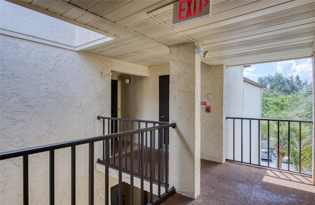 700 Starkey Rd Unit 1145, Largo, FL 33771 - hallway featuring an upstairs landing and a skylight