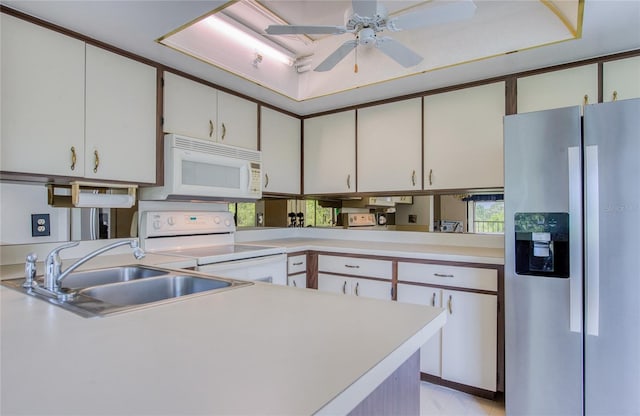 700 Starkey Rd Unit 1145, Largo, FL 33771 - kitchen with white appliances, light countertops, a ceiling fan, and white cabinetry