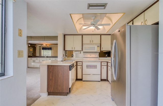 700 Starkey Rd Unit 1145, Largo, FL 33771 - kitchen featuring white appliances, a peninsula, cream cabinets, ceiling fan, and light countertops