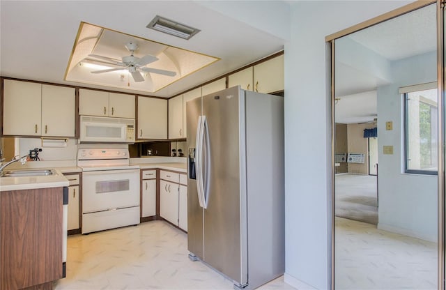 700 Starkey Rd Unit 1145, Largo, FL 33771 - kitchen featuring white appliances, ceiling fan, light countertops, and cream cabinetry