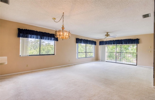 700 Starkey Rd Unit 1145, Largo, FL 33771 - spare room with a textured ceiling, carpet, a chandelier, and a ceiling fan