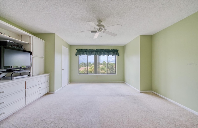 700 Starkey Rd Unit 1145, Largo, FL 33771 - unfurnished bedroom featuring light carpet, ceiling fan, and a textured ceiling