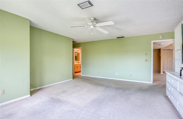 700 Starkey Rd Unit 1145, Largo, FL 33771 - unfurnished bedroom featuring light carpet, a textured ceiling, and ceiling fan