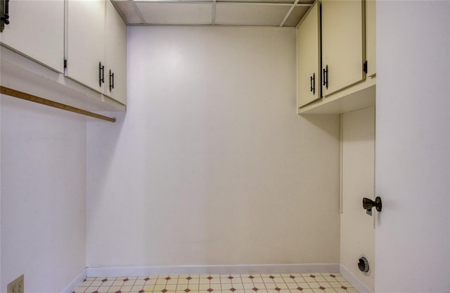 700 Starkey Rd Unit 1145, Largo, FL 33771 - laundry area featuring light flooring and cabinet space