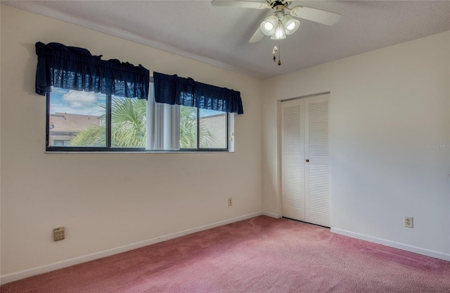 700 Starkey Rd Unit 1145, Largo, FL 33771 - unfurnished bedroom featuring carpet flooring, a closet, and ceiling fan