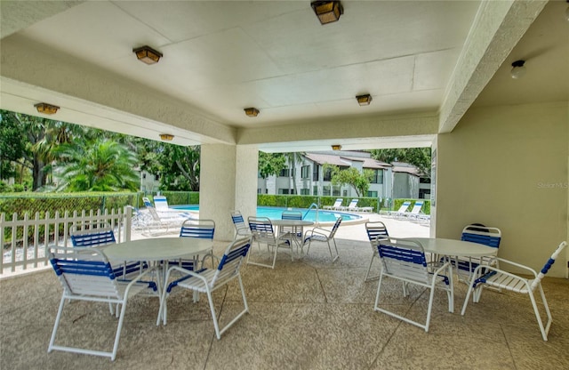 700 Starkey Rd Unit 1145, Largo, FL 33771 - view of patio with outdoor dining space and a community pool
