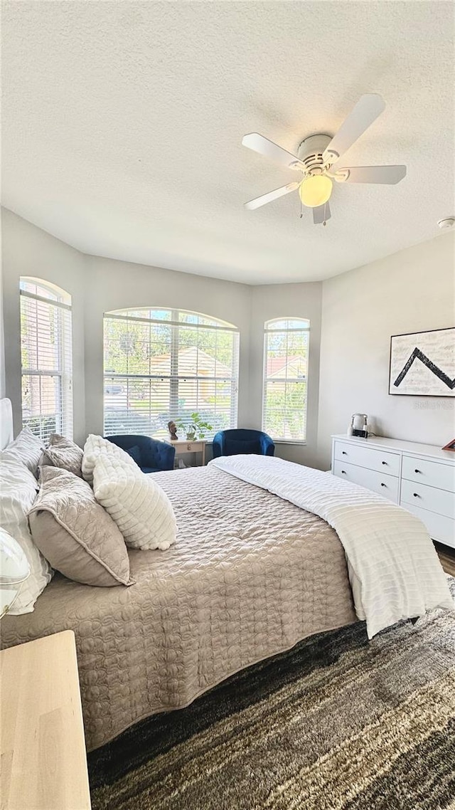27312 Edenfield Dr, Wesley Chapel, FL 33544 - bedroom with a textured ceiling, a ceiling fan, and wood finished floors
