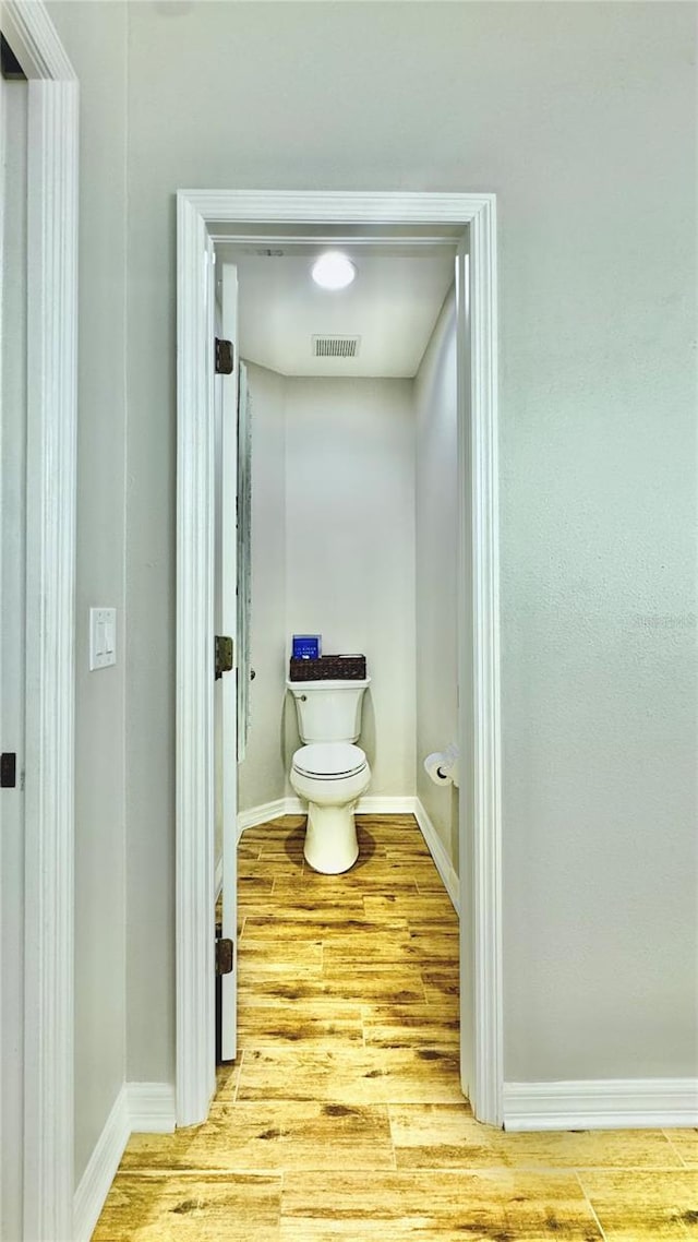27312 Edenfield Dr, Wesley Chapel, FL 33544 - bathroom with toilet and wood finished floors