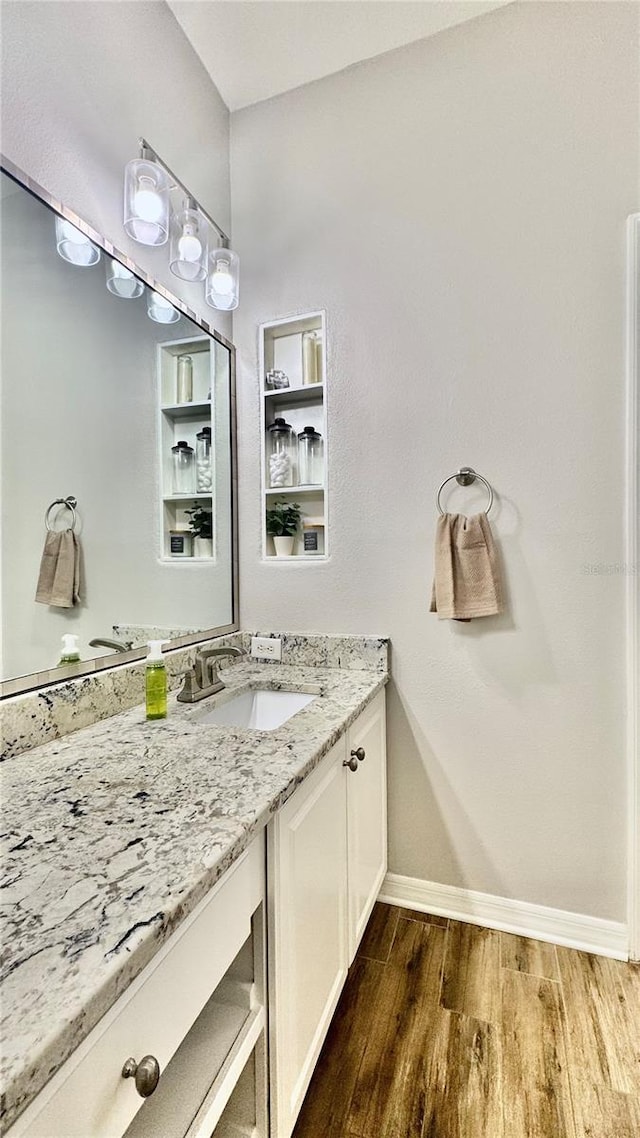 27312 Edenfield Dr, Wesley Chapel, FL 33544 - bathroom with wood finished floors and vanity