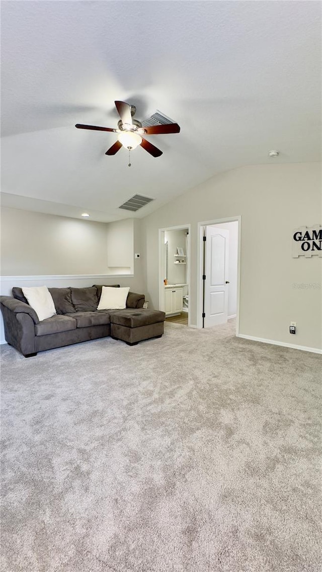 27312 Edenfield Dr, Wesley Chapel, FL 33544 - carpeted living area with a ceiling fan and lofted ceiling