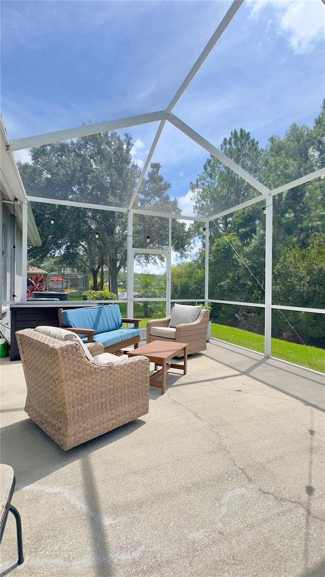 27312 Edenfield Dr, Wesley Chapel, FL 33544 - view of patio featuring an outdoor living space and glass enclosure