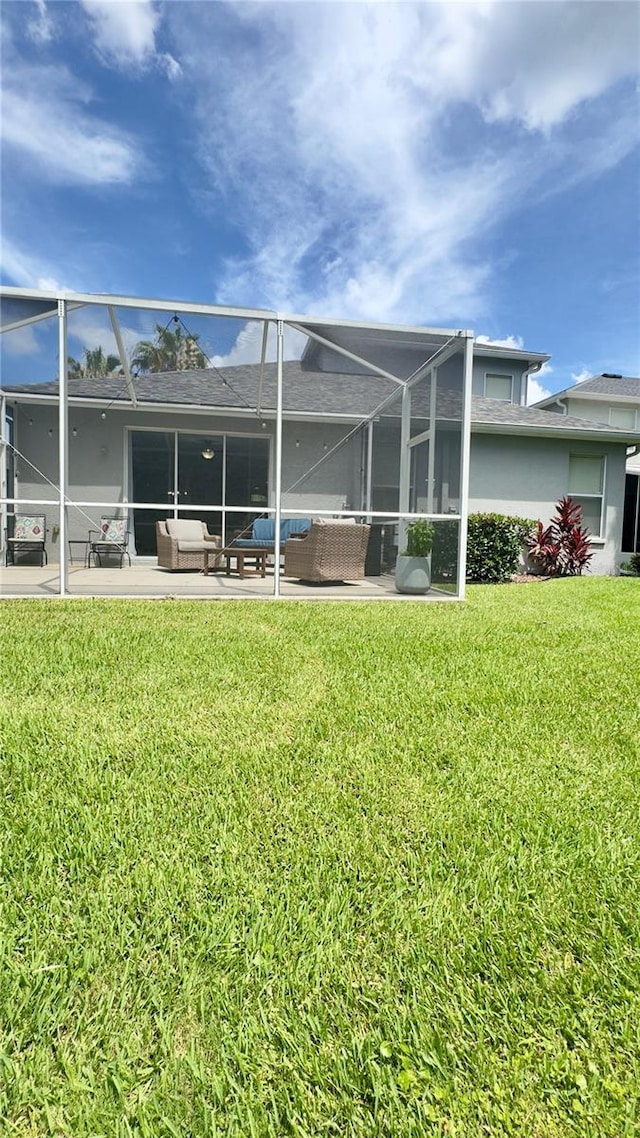 27312 Edenfield Dr, Wesley Chapel, FL 33544 - back of house featuring an outdoor hangout area, a lawn, a patio, and a lanai