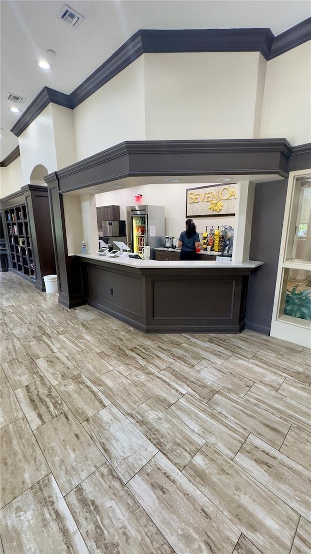 27312 Edenfield Dr, Wesley Chapel, FL 33544 - bar featuring crown molding and wood tiled floors