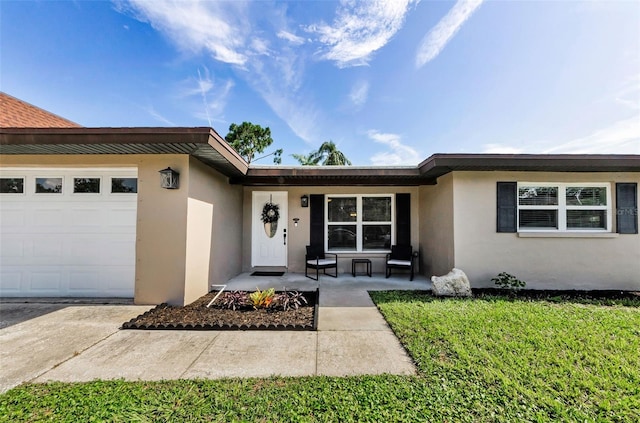1800 Mapleleaf Blvd, Oldsmar, FL 34677 - doorway to property with stucco siding and an attached garage