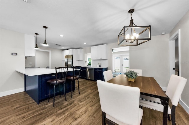1800 Mapleleaf Blvd, Oldsmar, FL 34677 - dining space featuring dark wood finished floors, a chandelier, french doors, and recessed lighting