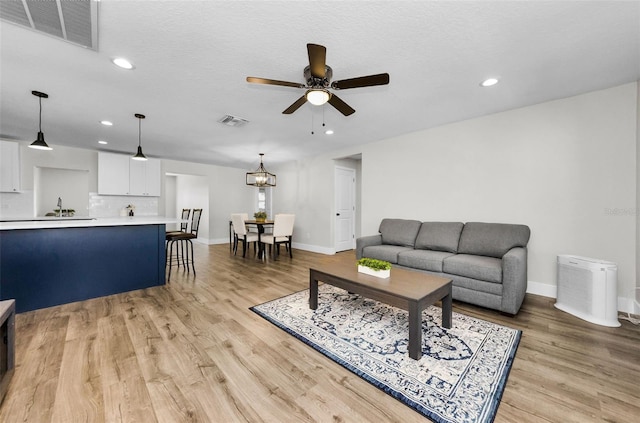1800 Mapleleaf Blvd, Oldsmar, FL 34677 - living room featuring ceiling fan, recessed lighting, and light wood-style flooring