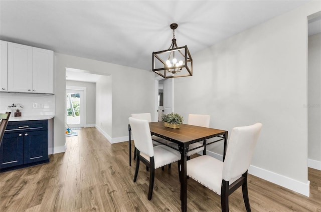 1800 Mapleleaf Blvd, Oldsmar, FL 34677 - dining area with light wood-type flooring and a chandelier