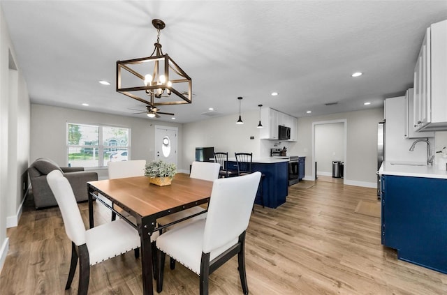 1800 Mapleleaf Blvd, Oldsmar, FL 34677 - dining space with a chandelier, light wood-type flooring, recessed lighting, and ceiling fan