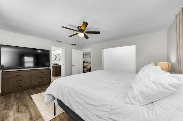 1800 Mapleleaf Blvd, Oldsmar, FL 34677 - bedroom featuring dark wood-style flooring, a ceiling fan, and ensuite bath