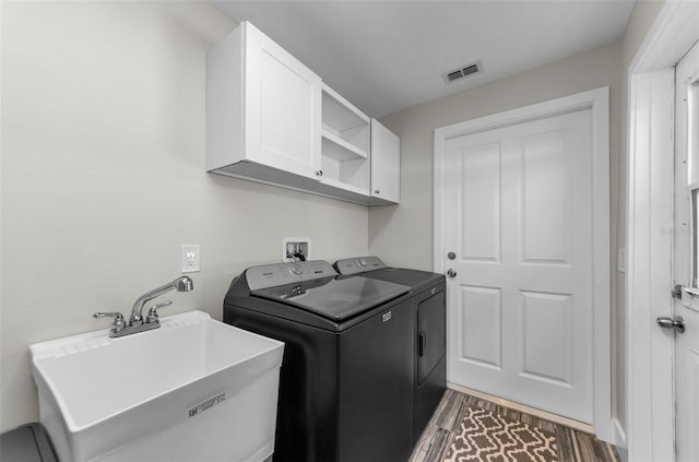 1800 Mapleleaf Blvd, Oldsmar, FL 34677 - washroom featuring washer and clothes dryer and cabinet space