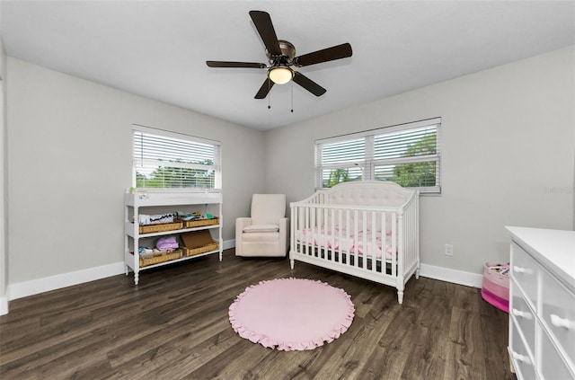 1800 Mapleleaf Blvd, Oldsmar, FL 34677 - bedroom featuring multiple windows, wood finished floors, a crib, and a ceiling fan