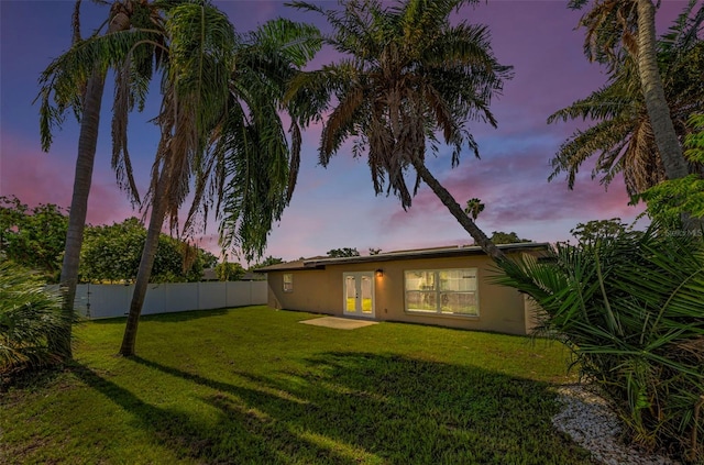 1800 Mapleleaf Blvd, Oldsmar, FL 34677 - back of house at dusk featuring french doors and stucco siding