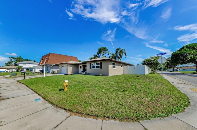 1800 Mapleleaf Blvd, Oldsmar, FL 34677 - view of front facade with a garage, stucco siding, and concrete driveway
