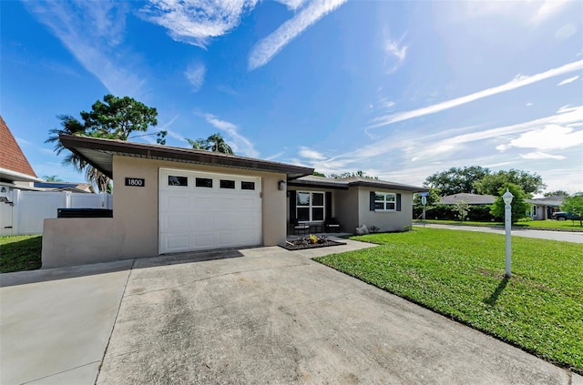 1800 Mapleleaf Blvd, Oldsmar, FL 34677 - single story home featuring stucco siding, driveway, a garage, and a front lawn