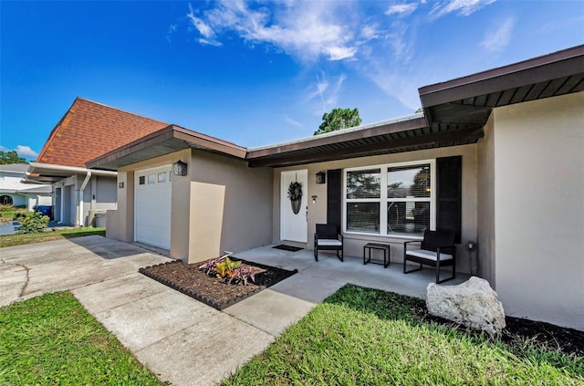 1800 Mapleleaf Blvd, Oldsmar, FL 34677 - property entrance featuring stucco siding, covered porch, an attached garage, and concrete driveway