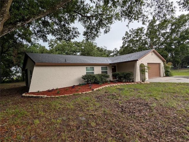 11308 Echo View Dr, Odessa, FL 33556 - view of front of home featuring stucco siding, a garage, and driveway