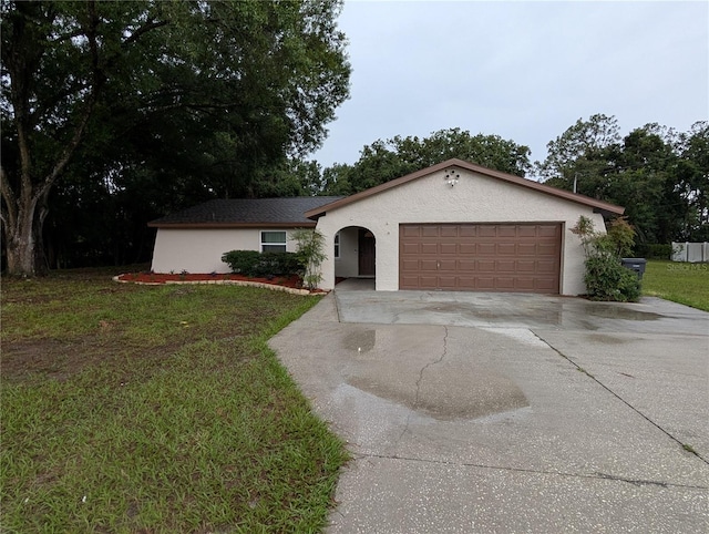 11308 Echo View Dr, Odessa, FL 33556 - view of front of home with driveway, stucco siding, a garage, and a front lawn