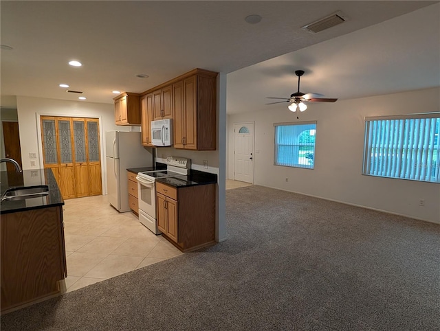 11308 Echo View Dr, Odessa, FL 33556 - kitchen featuring white appliances, a ceiling fan, dark countertops, recessed lighting, and light carpet
