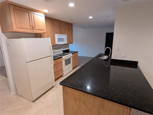11308 Echo View Dr, Odessa, FL 33556 - kitchen featuring white appliances, a peninsula, dark stone counters, recessed lighting, and light tile patterned floors