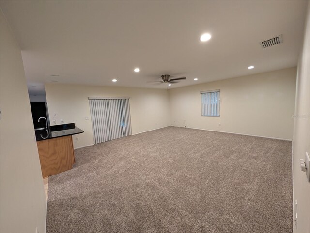 11308 Echo View Dr, Odessa, FL 33556 - unfurnished living room featuring ceiling fan, carpet, and recessed lighting