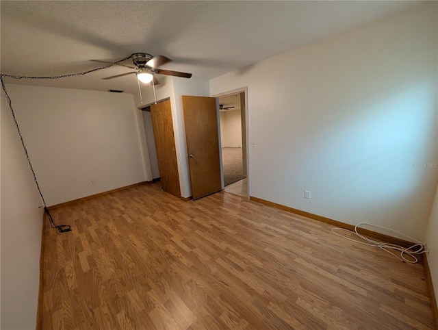 11308 Echo View Dr, Odessa, FL 33556 - unfurnished bedroom with light wood-type flooring and a ceiling fan