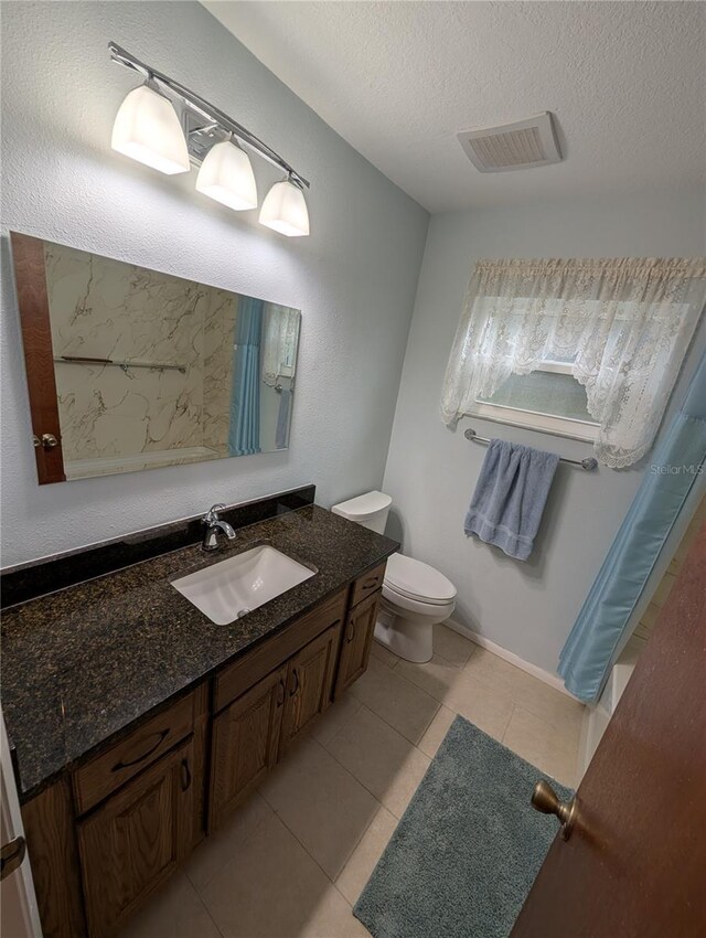 11308 Echo View Dr, Odessa, FL 33556 - bathroom with vanity, curtained shower, tile patterned flooring, and a textured ceiling