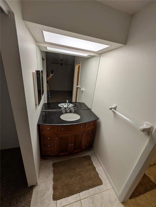 11308 Echo View Dr, Odessa, FL 33556 - bathroom with a skylight, vanity, and tile patterned floors