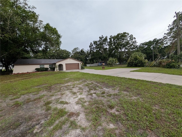 11308 Echo View Dr, Odessa, FL 33556 - view of green lawn featuring concrete driveway and an attached garage