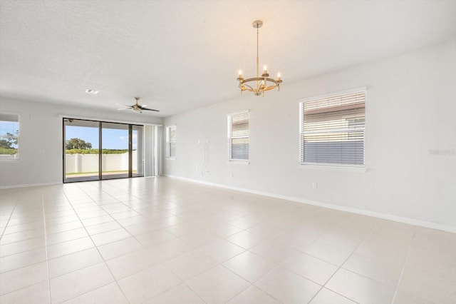 11745 Brighton Knoll Loop, Riverview, FL 33579 - spare room with a chandelier, healthy amount of natural light, light tile patterned floors, and a ceiling fan