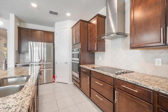 11745 Brighton Knoll Loop, Riverview, FL 33579 - kitchen featuring wall chimney range hood, stainless steel appliances, backsplash, light stone countertops, and recessed lighting