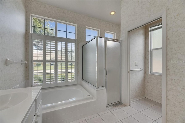 1216 Fox Chapel Dr, Lutz, FL 33549 - bathroom featuring tile patterned flooring, plenty of natural light, a shower stall, and vanity