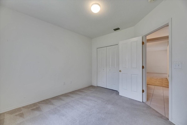 1216 Fox Chapel Dr, Lutz, FL 33549 - unfurnished bedroom featuring carpet flooring and a closet